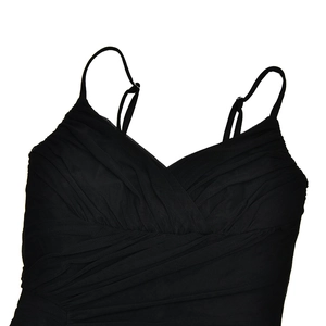 Detailed close-up of a black pleated strap top with fine adjustable spaghetti straps