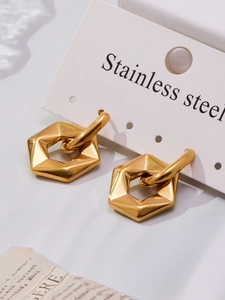 Macro shot of minimalist gold stainless steel geometric hoop earrings with polished finish