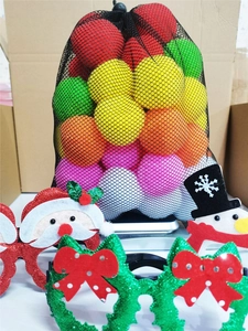 Close-up of colorful Christmas snowball toy set with festive Santa and snowman glasses