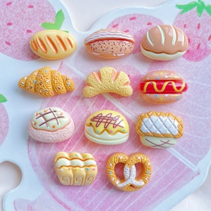Miniature resin food charms featuring realistic croissants hot dogs and donuts models