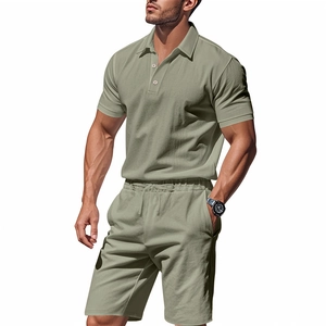 Detail of sage green men's linen polo and drawstring shorts set with textured fabric