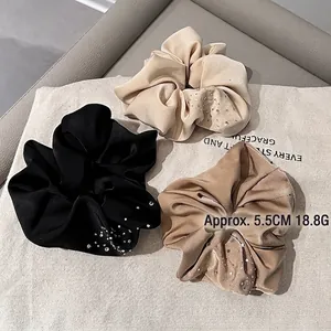 Elegant satin hair scrunchies set with rhinestones in black, champagne and brown