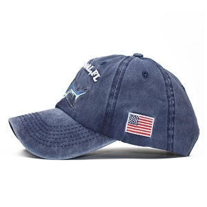 Washed navy blue cotton baseball cap with embroidered marlin fish and American flag patch