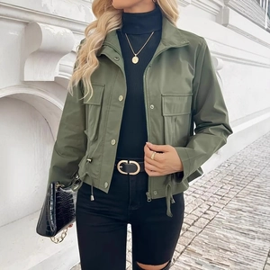 Detail of olive green utility jacket featuring drawstring hem and large cargo pockets