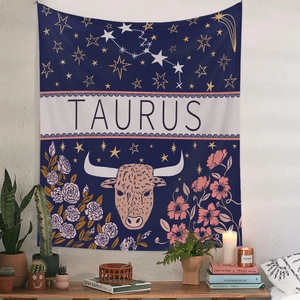 Detail of Taurus zodiac tapestry with floral patterns and constellations on white wall