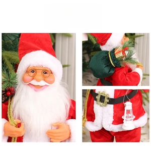 Detail of 24-inch Santa Claus doll showing gold glasses, velvet gift bag and lantern