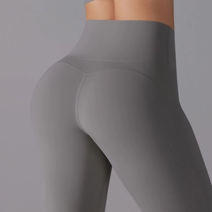 Macro detail of high-waist seam and scrunch butt stitching on grey yoga leggings