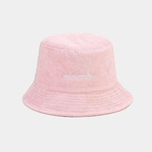 Detail of pink towel fabric bucket hat featuring white mama embroidery and stitched brim