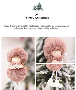 Detail of pink plush Christmas angel with silver star and white boots for holiday decor