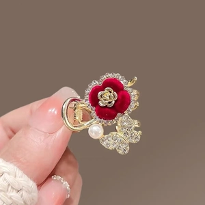 Golden hair claw clip with red flocked flower, rhinestone butterfly and pearl detail