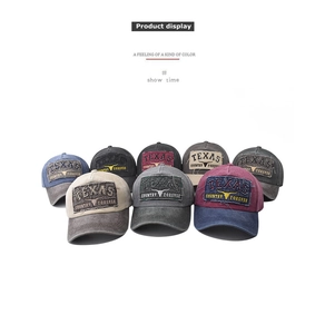 Group display of washed cotton baseball caps with Texas bull embroidery in multiple colors