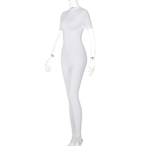 Detail view of the white short sleeve yoga jumpsuit with slim fit tailoring and round neck