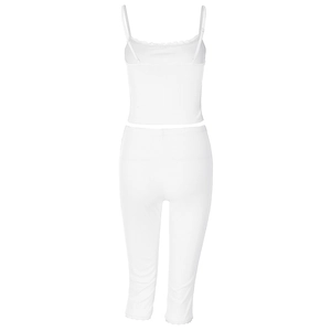 Close-up of white ribbed knit fabric with delicate lace trim on camisole and pants set