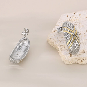 Elegant two-tone stainless steel stud earrings featuring micro-pave cubic zirconia inlay
