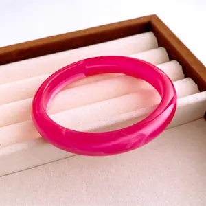 Minimalist transparent rose pink resin bangle with natural marble texture inside