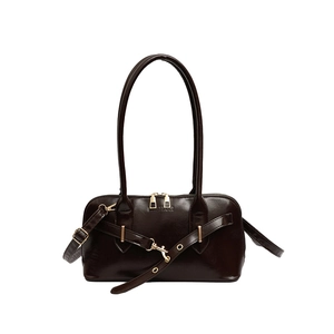 Vintage dark brown patent leather bowling bag with gold hardware and top handles