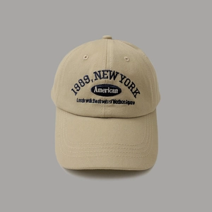 Khaki vintage baseball cap with navy 1989 New York embroidery and American text