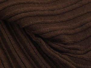 Macro shot of dark brown ribbed knit fabric texture on this two-piece skirt set