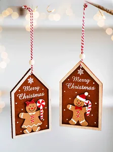 Detail of wooden Merry Christmas house ornaments with cute felt gingerbread men