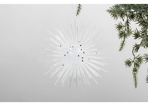 Sparkling white starburst Christmas ornament with silver glitter detail and pine accents