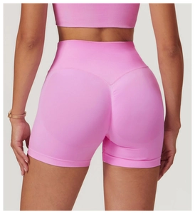 Rear view of pink seamless high-waisted yoga shorts with scrunch butt lifting detail