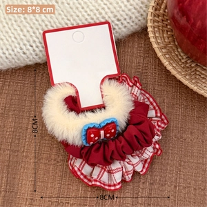 Close-up of a plush red polka dot bow scrunchie with lace edges, size 8x8cm