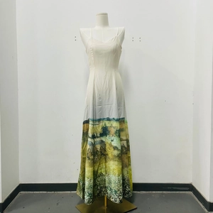 Detail of elegant white maxi dress featuring V-neckline and artistic oil painting landscape print