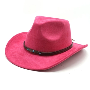 Macro detail of rose pink suede western hat with turquoise studded leather band