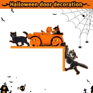 Macro detail of Halloween wooden door corner decor featuring black cats and orange pumpkins