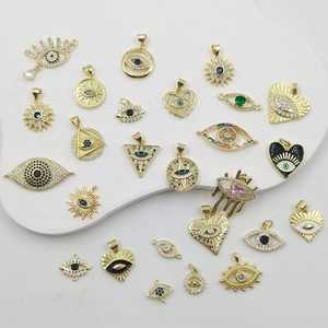Gold-plated evil eye charms with colorful zircon stones in various shapes for jewelry making