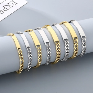 Detail view of men's titanium steel Cuban link ID bracelets in gold and silver finish