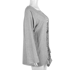 Detail view of grey sweatshirt featuring unique side pleats and ruffled stitching texture