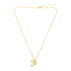 Macro detail of bird pendant necklace with sparkling white cubic zirconia on gold chain