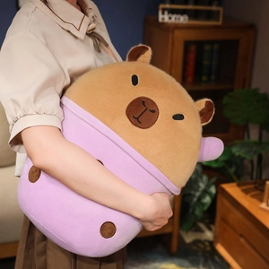 Close-up of a large capybara plush toy inside a purple milk tea cup held by a person
