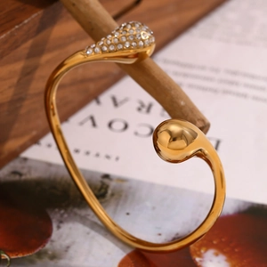 18K gold plated stainless steel open bangle with crystal pavé and polished ball accents
