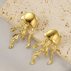Polished gold jellyfish earrings on stone base, minimalist stainless steel design