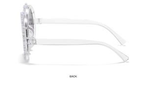 Side view of transparent floral sunglasses for children with pearl decorative frame edges