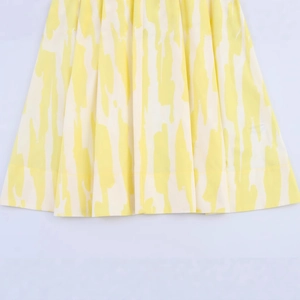 Women's casual midi skirt featuring yellow and white mottled pattern texture