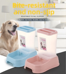 Detail of gravity pet feeder with translucent frosted tank and wide food bowl for dogs