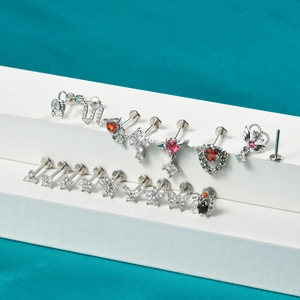Collection of stainless steel labret studs with colorful zircons in diverse animal shapes