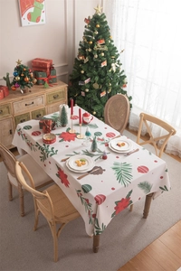 Detailed Christmas tablecloth with red poinsettia floral prints and festive tassel edge