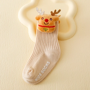 Close-up of kids' beige ribbed mid-tube socks with 3D plush reindeer and non-slip soles