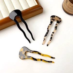 Three U-shaped acetate hairpins with tortoise shell and floral patterns for buns