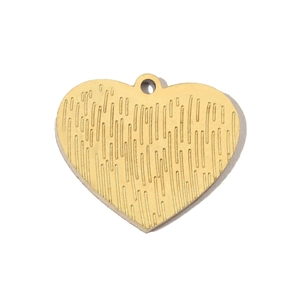 Macro view of gold heart pendant with vertical brushed texture and round bail attachment