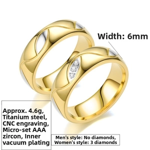 Close-up of titanium steel couple rings with gold wave texture and CZ stones