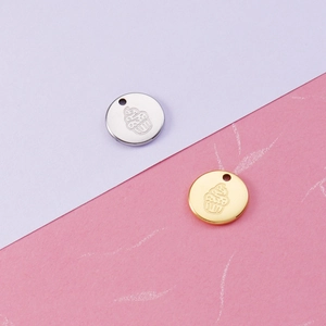 Polished round stainless steel 18K gold and silver charms with unique engravings