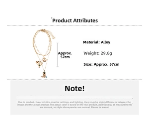 Detail showing vintage gold alloy necklace with western boot, cactus, and star charms