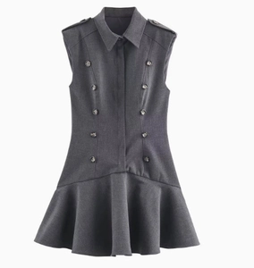 Detail of dark grey sleeveless dress showing shoulder epaulettes and double-breasted buttons