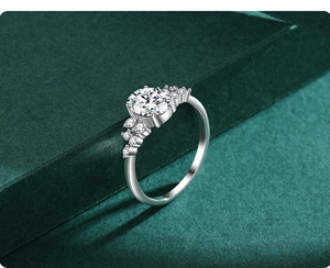 Macro view of a round zircon S925 sterling silver ring with pavé side stones