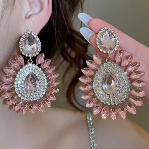 Sparkling pink crystal teardrop flower earrings with silver needle and pavé accents